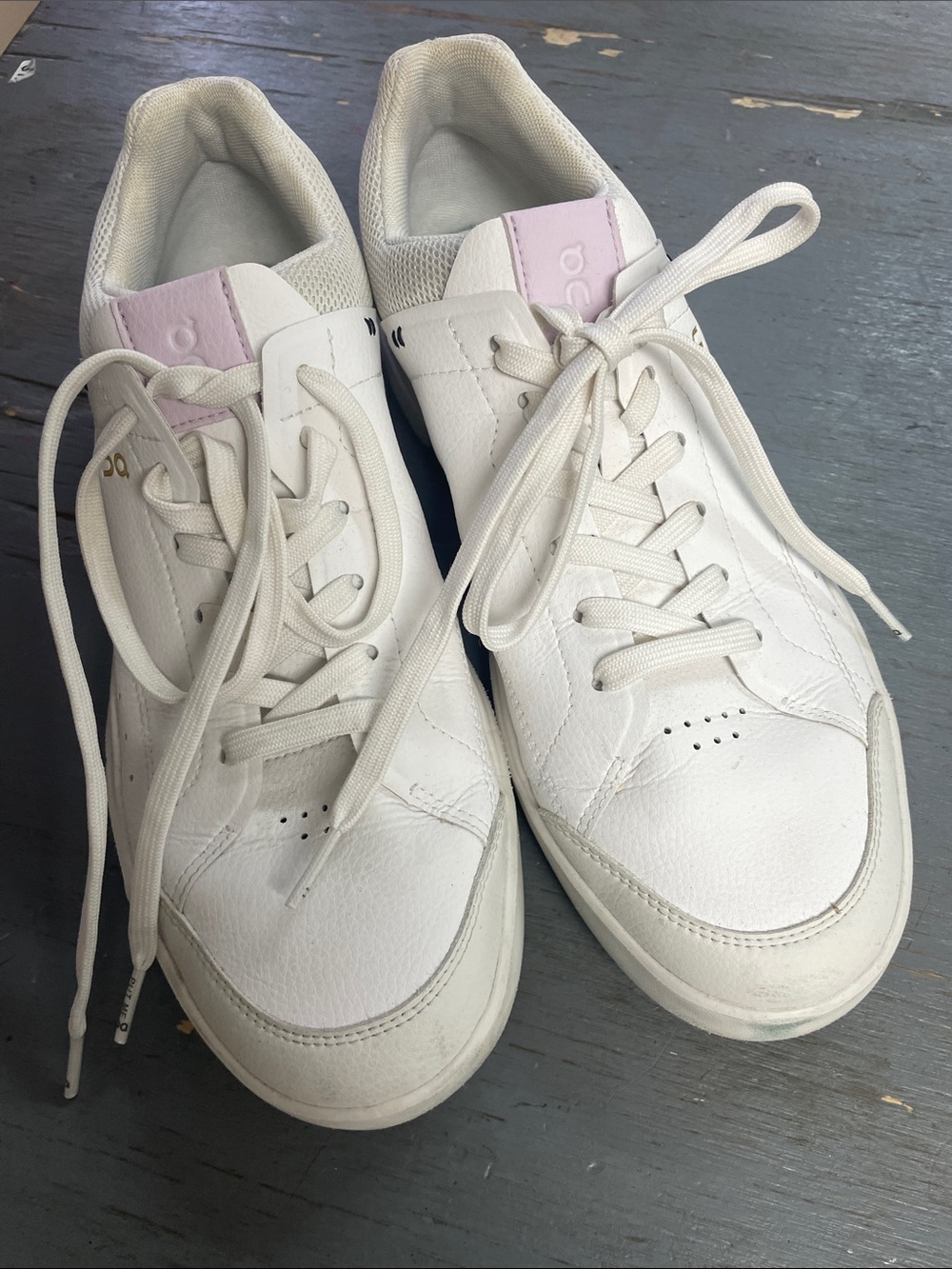 On cloud Running White Leather Sneakers with Light Pink Tongue.  The Roger.